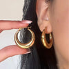Smooth Stainless Steel Circle Hoop Earrings in Gold Tone and Silver Tone - Image 1