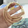 Large Circle Clip-On Earrings with Metallic Finish - Image 1