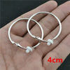 Large Circle Clip-On Earrings with Metallic Finish - Image 16