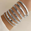 Seven-Piece Metal Bangle Set with Heart Motifs in Gold-Tone or Silver-Tone - Image 3