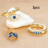 Three Piece Evil Eye Hoop Earring Set with Blue Stone Accents - Image 15