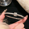 Stainless Steel Bangle Bracelet with Cubic Zirconia Details in Gold-Tone or Silver-Tone - Image 13