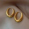 Chunky Oval Hoop Earrings in Gold-Tone or Silver-Tone - Image 1