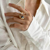 Geometric Open Ring with Contrasting Clear Stone Details - Image 3