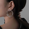 Irregular Twisted Hoop Earrings with Sculptural Metal Profile - Image 3
