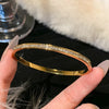 Stainless Steel Bangle Bracelet with Cubic Zirconia Details in Gold-Tone or Silver-Tone - Image 11