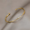 Twisted Mobius Open Cuff Bangle in Gold-Tone or Silver-Tone - Image 1