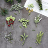 Green Botanical Brooch Pin with Leaf and Flower Designs - Image 1
