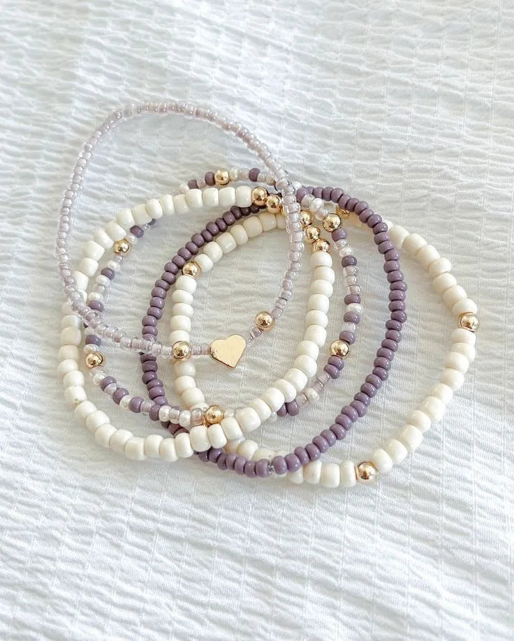 Five-Piece Beaded Elastic Bracelet Set with Decorative Charms - Image 1