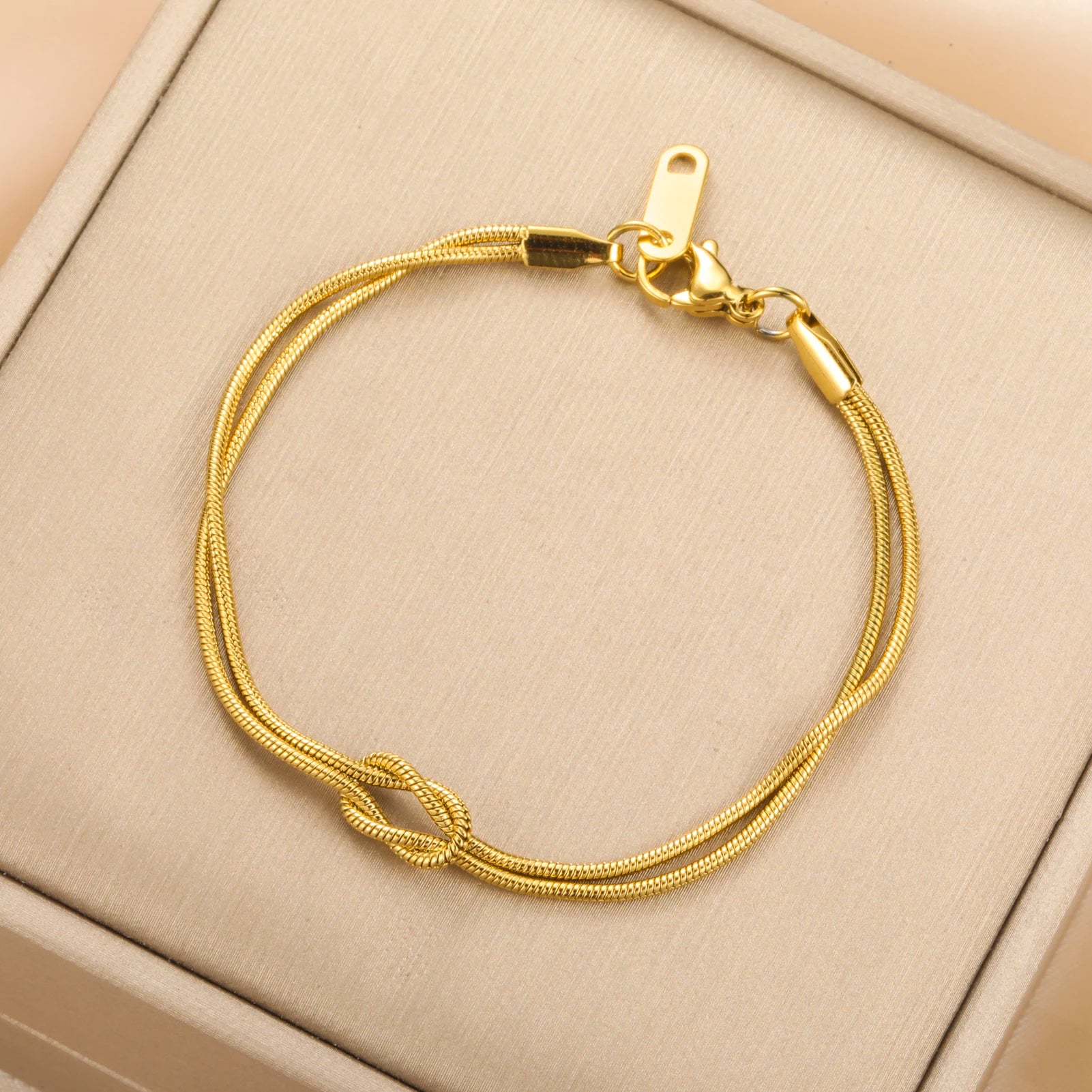 Stainless Steel Double Snake Chain Love Knot Bracelet with Adjustable Length - Image 1