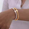 Minimalist Stretch Cross Bracelet for Women,Round Beads Bracelets，Stainless Steel Jewelry Gift - Image 1