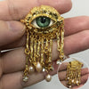 Eye Motif Tassel Brooch with Metal Chain Details - Image 1