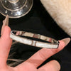 Stainless Steel Bangle Bracelet with Cubic Zirconia Details in Gold-Tone or Silver-Tone - Image 9