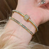 Stainless Steel Bangle Bracelet with Cubic Zirconia Details in Gold-Tone or Silver-Tone - Image 4