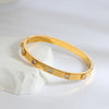 316L Stainless Steel Bangle Bracelet with Cubic Zirconia Details in Gold-Tone - Image 29