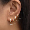 Crystal Huggie Hoop Earrings in Gold-Tone or Silver-Tone - Image 9
