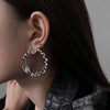 Irregular Twisted Hoop Earrings with Sculptural Metal Profile - Image 4