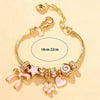 Heart-Shaped Bracelet with Bow Detail in Gold-Tone - Image 5