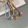 Evil Eye Charm Necklace with Colorful Beads in a Choker Style - Image 1