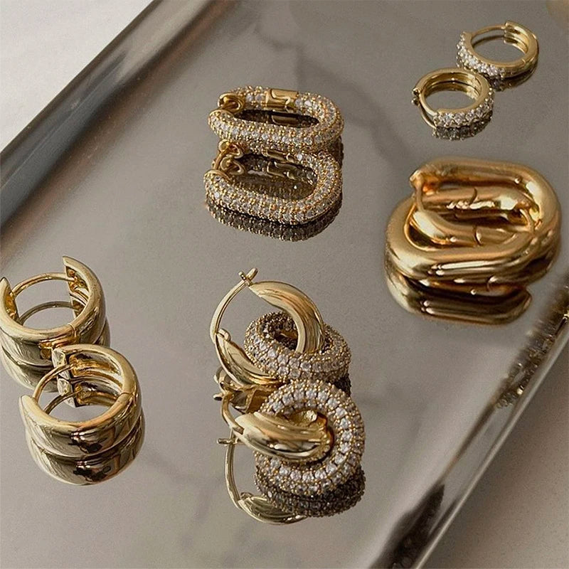 Cubic Zirconia Huggie Hoop Earrings in Gold-Tone Stainless Steel - Image 1
