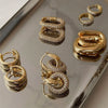Cubic Zirconia Huggie Hoop Earrings in Gold-Tone Stainless Steel - Image 1
