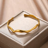 Stainless Steel Wave Open Bangle Bracelet in Gold-Tone or Silver-Tone - Image 1