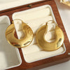 U-Shaped Chunky Hoop Earrings with Geometric Profile - Image 14