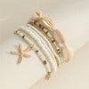 7 Pcs Stackable Starfish Pendant Bracelet Set with Mini Seed Beads Handcrafted Beach Jewelry for Women - Image 1