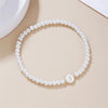 A-Z Initial Letter Bracelet for Women White Beads Round Pendant Elastic Bracelets Jewelry Mother of Pearl Charm - Image 23