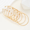 Seven-Piece Metal Bangle Set with Heart Motifs in Gold-Tone or Silver-Tone - Image 11