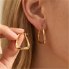 Geometric Twisted Hoop Earrings in Gold-Tone or Silver-Tone - Image 1