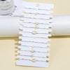 12 Bohemian Summer Shell Sea Star Rice Bead Braided Bracelet Set - Image 1