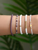 Five-Piece Beaded Elastic Bracelet Set with Decorative Charms - Image 2