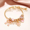 Heart-Shaped Bracelet with Bow Detail in Gold-Tone - Image 2