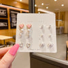 Pink Heart and Bow Stud Earrings Set with Pearl-Style Details - Image 1