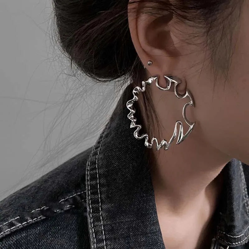 Irregular Twisted Hoop Earrings with Sculptural Metal Profile - Image 1