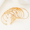 Seven Piece Heart Print Open Bangle Set in Gold Tone - Image 4
