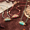 Double-Sided Eye Pendant Necklace with Woven Cord in Three Colors - Image 1