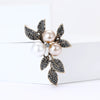 Rhinestone Flower Brooch Pin with Pearl and Leaf Designs - Image 10