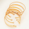 Seven Piece Heart Print Open Bangle Set in Gold Tone - Image 3