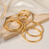 Twisted Hoop Earrings in Gold-Tone or Silver-Tone - Image 2