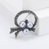 Rhinestone Flower Brooch Pin with Pearl and Leaf Designs - Image 12