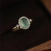 Oval Accent Ring for Women, Pale Green Center with Clear Halo and Gold-Tone Band