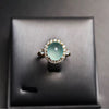 Oval Accent Ring for Women, Pale Green Center with Clear Halo and Gold-Tone Band