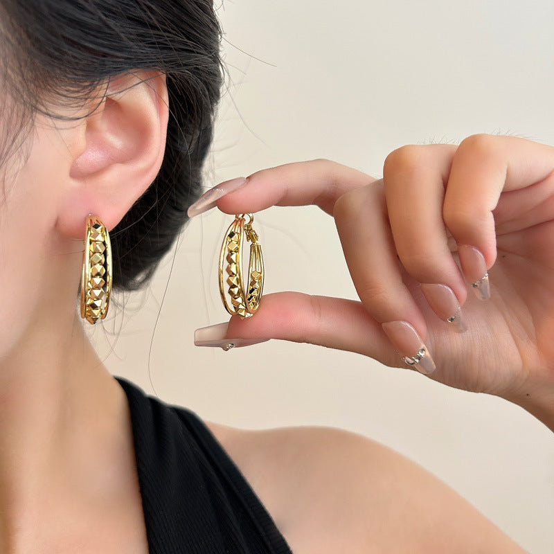 Oval Hoop Earrings for Women, Copper Design with Textured Surface in Gold or Silver Tone - Product view 1