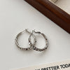 Oval Hoop Earrings for Women, Copper Design with Textured Surface in Gold or Silver Tone - Product view 4