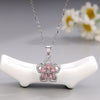 Rotating Flower Pendant Necklace for Women, Copper Bauhinia Design with Sparkling Zircon Accents - Product view 3