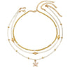 Layered Beaded Choker Necklace for Women with a Starfish Pendant and Gold-Tone Chains - Image 1