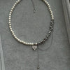 Imitation Pearl Choker Necklace with a Heart Pendant and Tassel Details