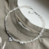 Imitation Pearl Choker Necklace with a Heart Pendant and Tassel Details